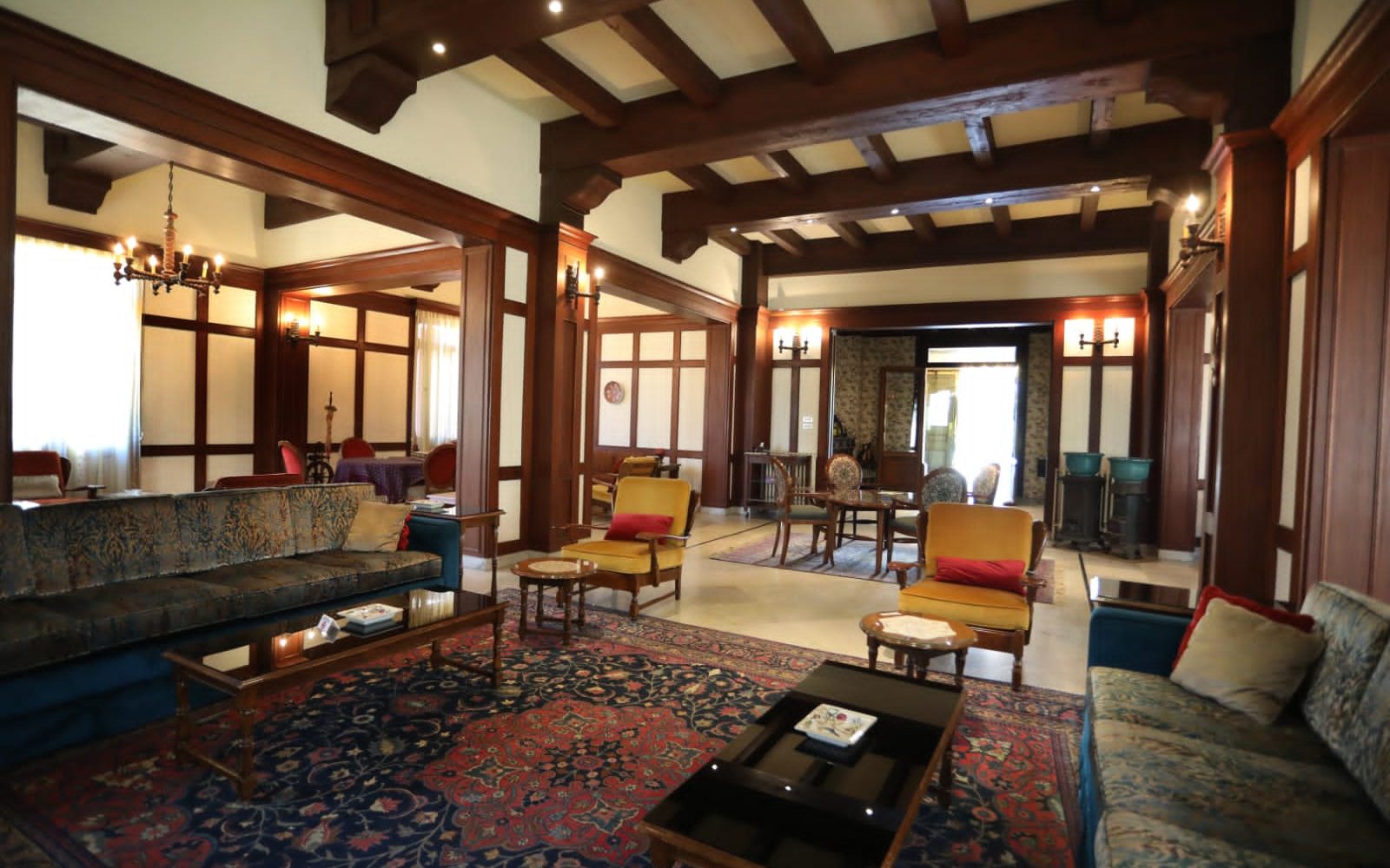 The lobby salon, timber beams and lamplight