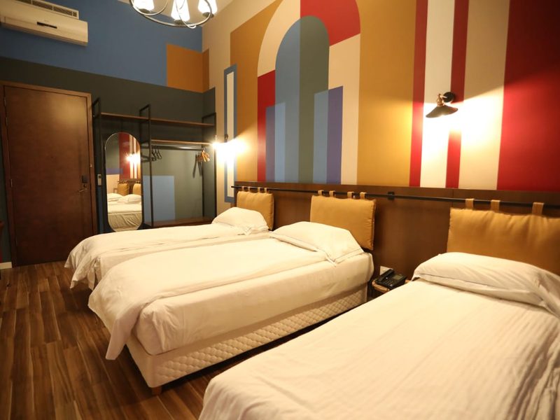 A renovated room with a painted mural wall